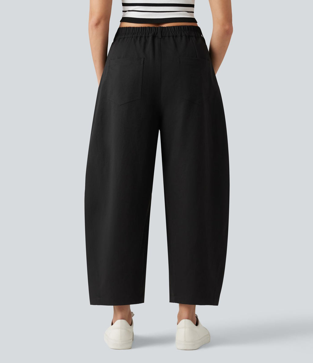 Pantalon décontracté à taille mi-haute, coupe ample et jambes fuselées, avec poches