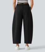 Pantalon décontracté à taille mi-haute, coupe ample et jambes fuselées, avec poches
