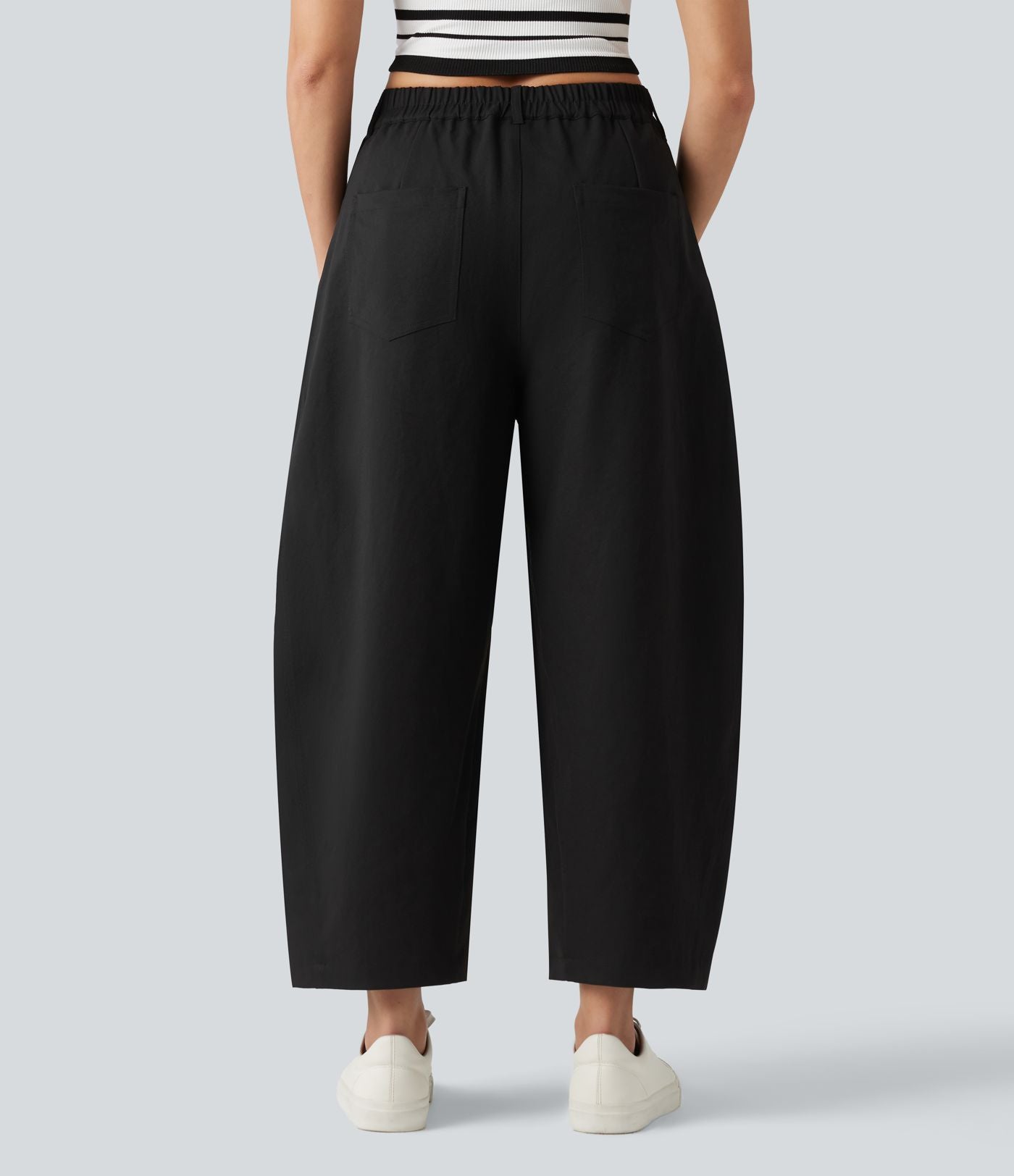 Pantalon décontracté à taille mi-haute, coupe ample et jambes fuselées, avec poches