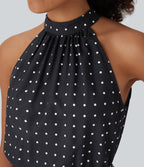 Robe mi-longue fluide de vacances à pois avec col licou, découpe dos, ceinture et poches latérales