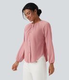 Blouse texturée col rond manches longues ourlet arrondi