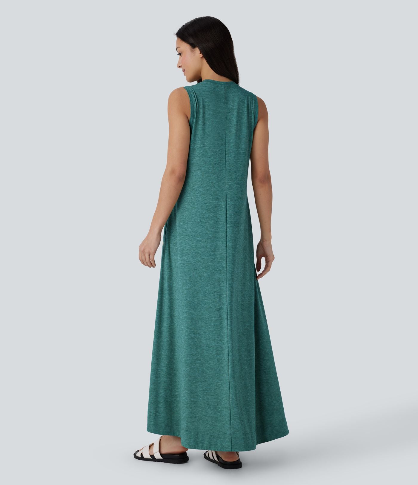 Robe longue décontractée fluide à col rond, sans manches, poches latérales et ourlet asymétrique