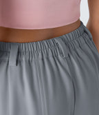 Pantalon tailleur ample, taille moyenne, coupe barrel, à poches