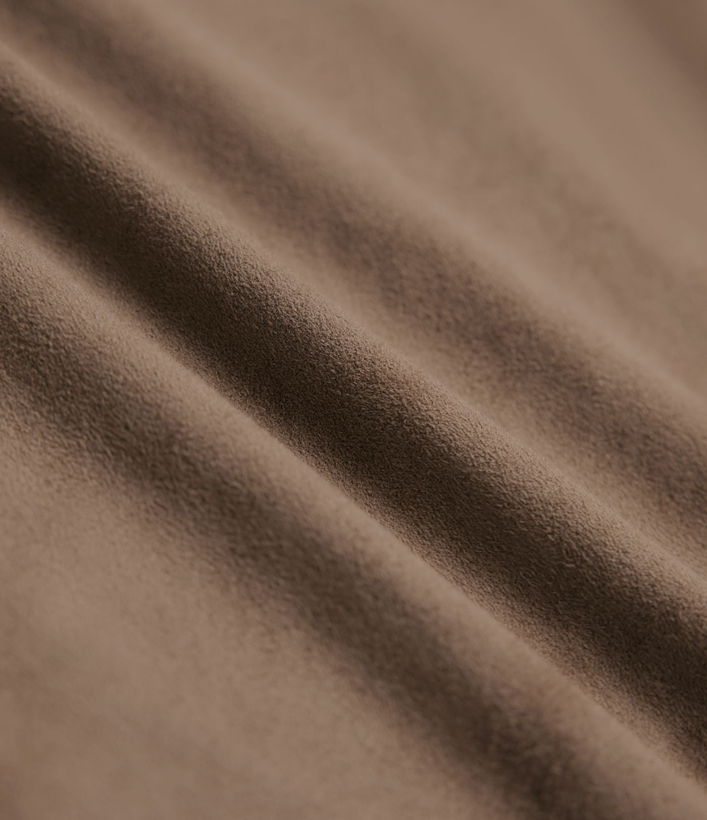 Jupe mi-longue évasée daim taille haute avec poches