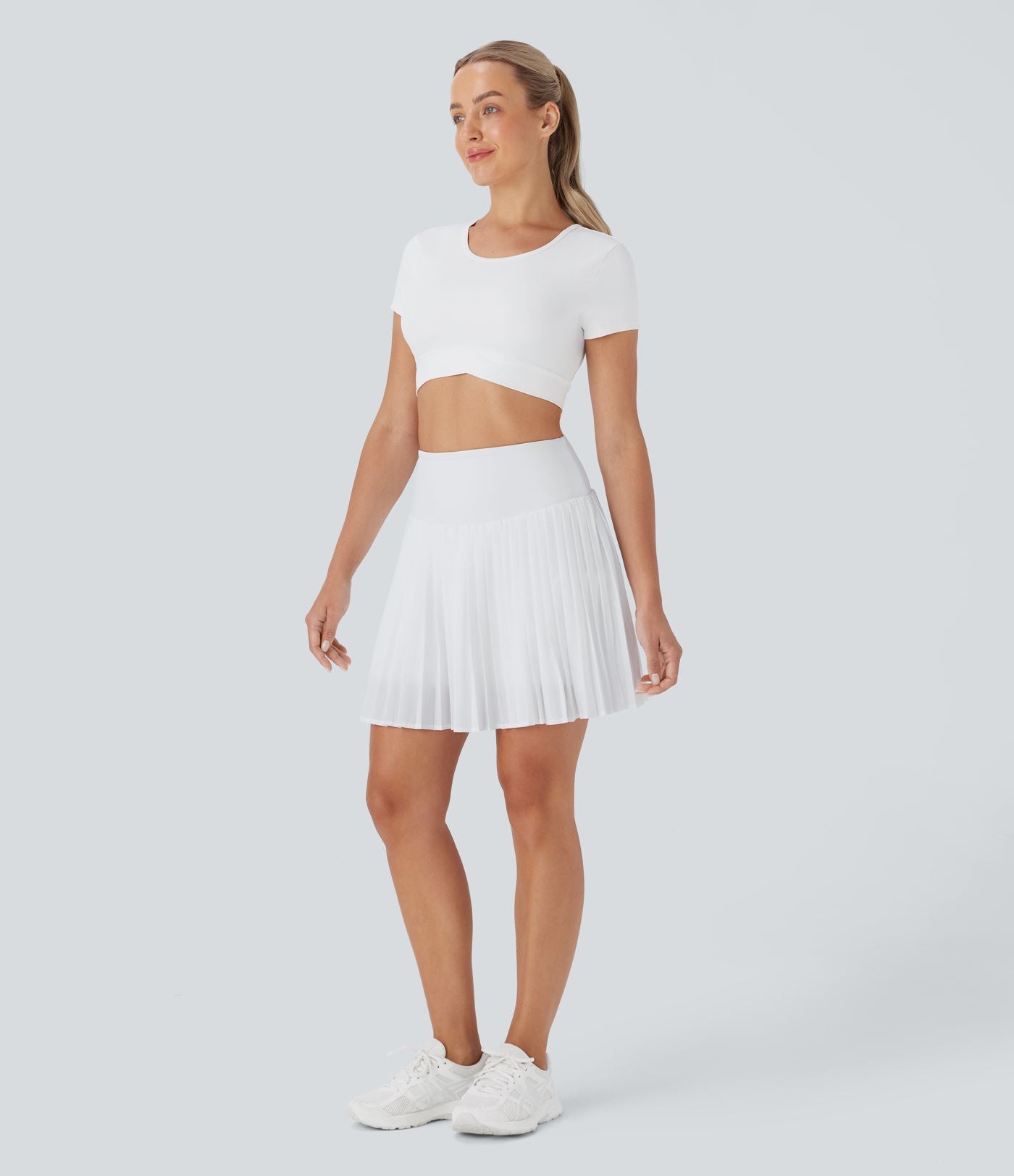 Jupe-short de tennis courte plissée 2-en-1 gainante taille haute à séchage rapide avec poches Breezeful™