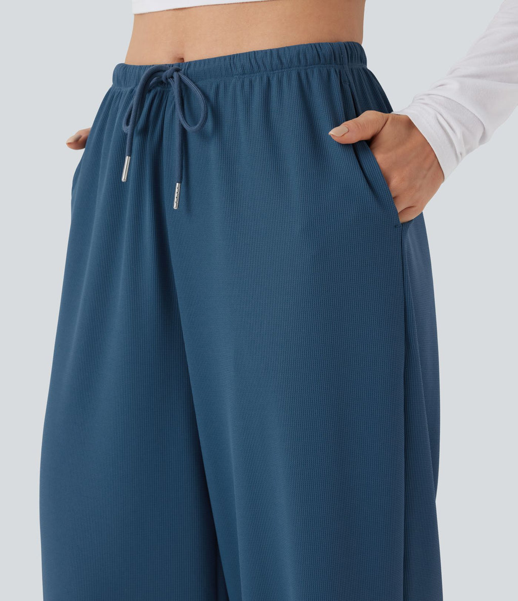 Pantalon de yoga tissu gaufré taille mi-haute jambe droite avec cordon de serrage et poches