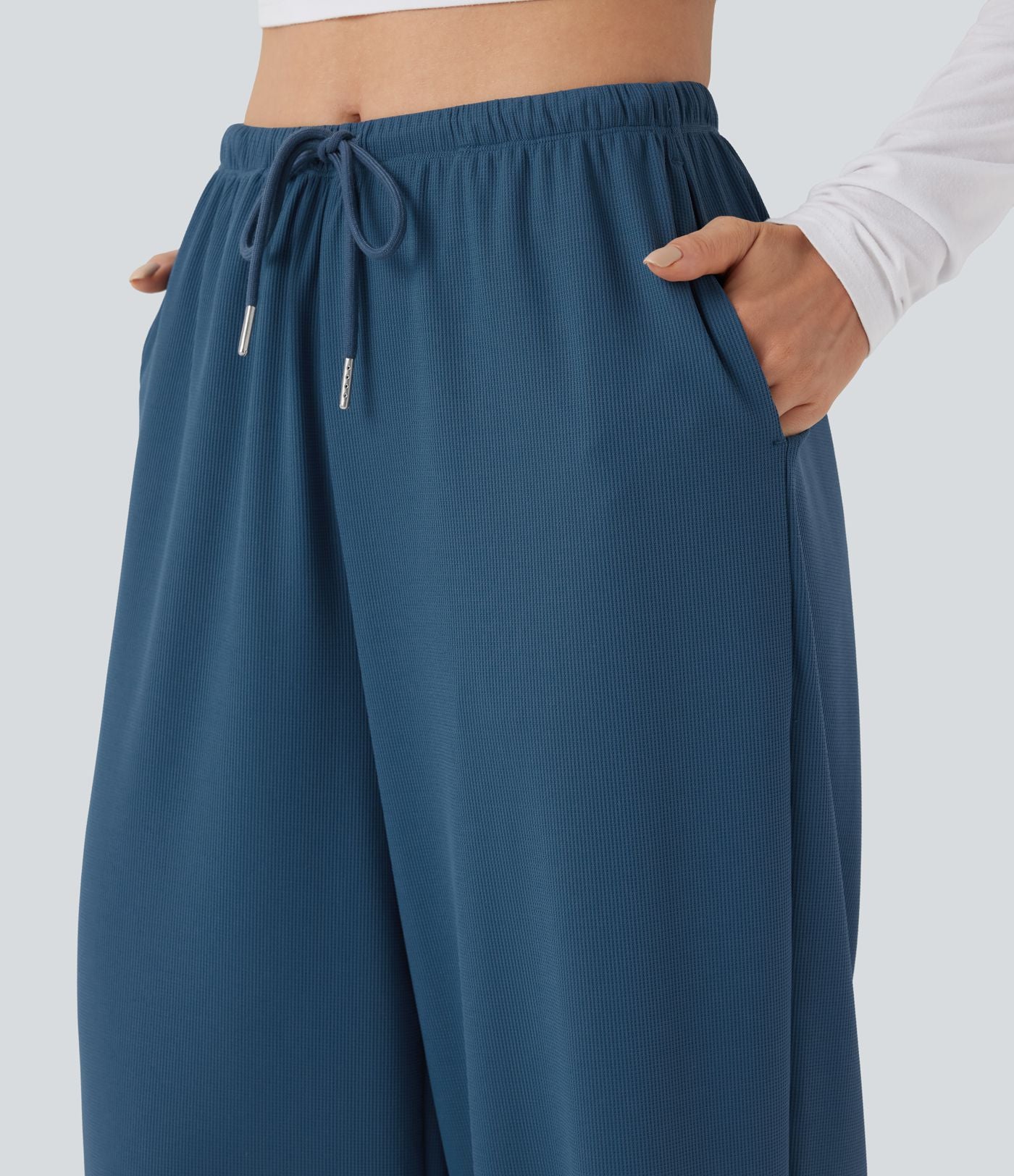 Pantalon de yoga tissu gaufré taille mi-haute jambe droite avec cordon de serrage et poches