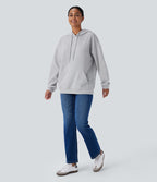 Sweat-shirt décontracté à capuche avec cordon de serrage, manches longues, poche kangourou, coupe croisée et fente
