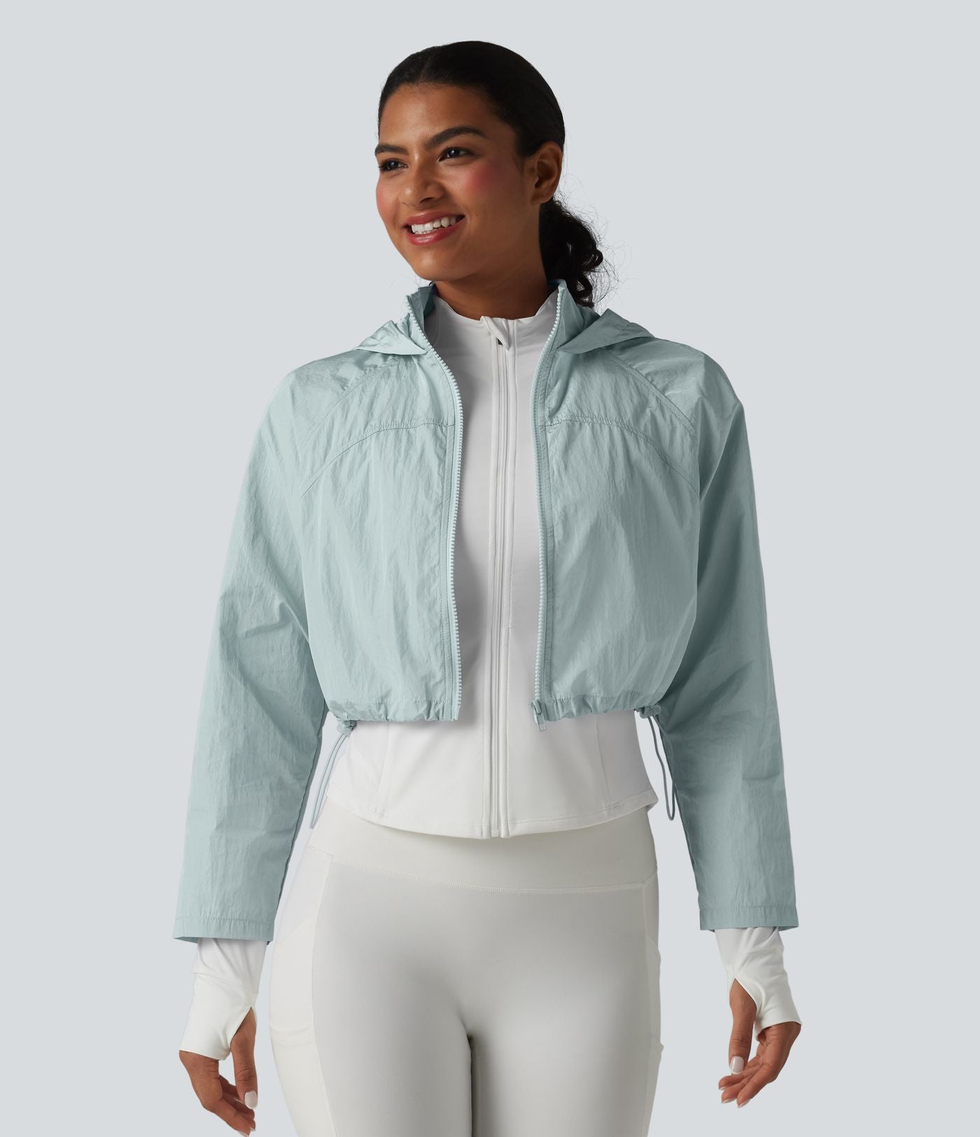 Veste de running 3-en-1 déperlante à capuche avec trous pour les pouces, ourlet arrondi et poches