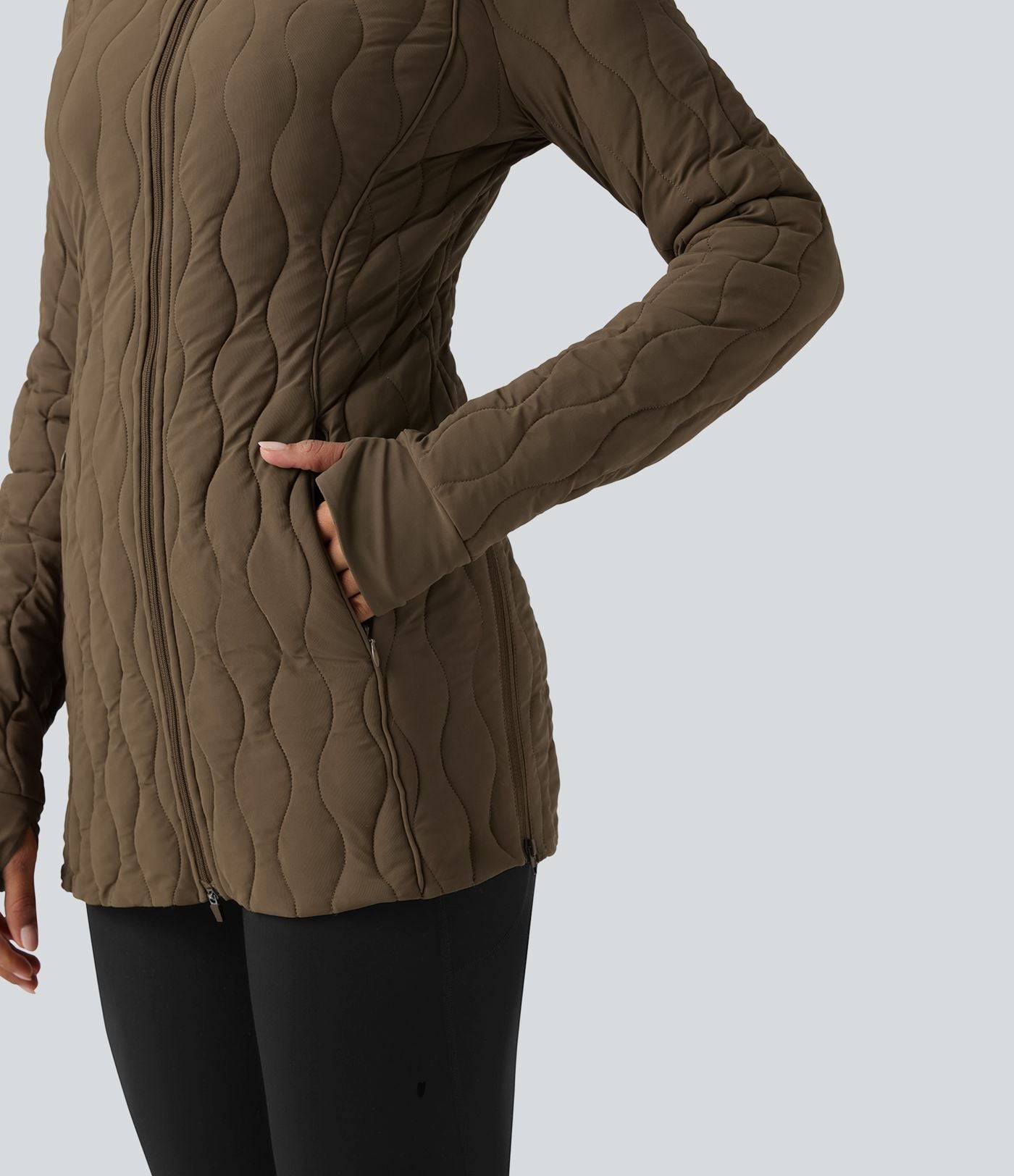 Veste matelassée de sport PuffFlex à col montant, manches longues, fermeture éclair avec passe-pouces et poches