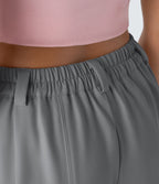 Pantalon tailleur ample, taille moyenne, coupe barrel, à poches