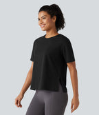 Haut de sport en coton col rond à manches courtes, ourlet fendu et coupe ample pour le yoga