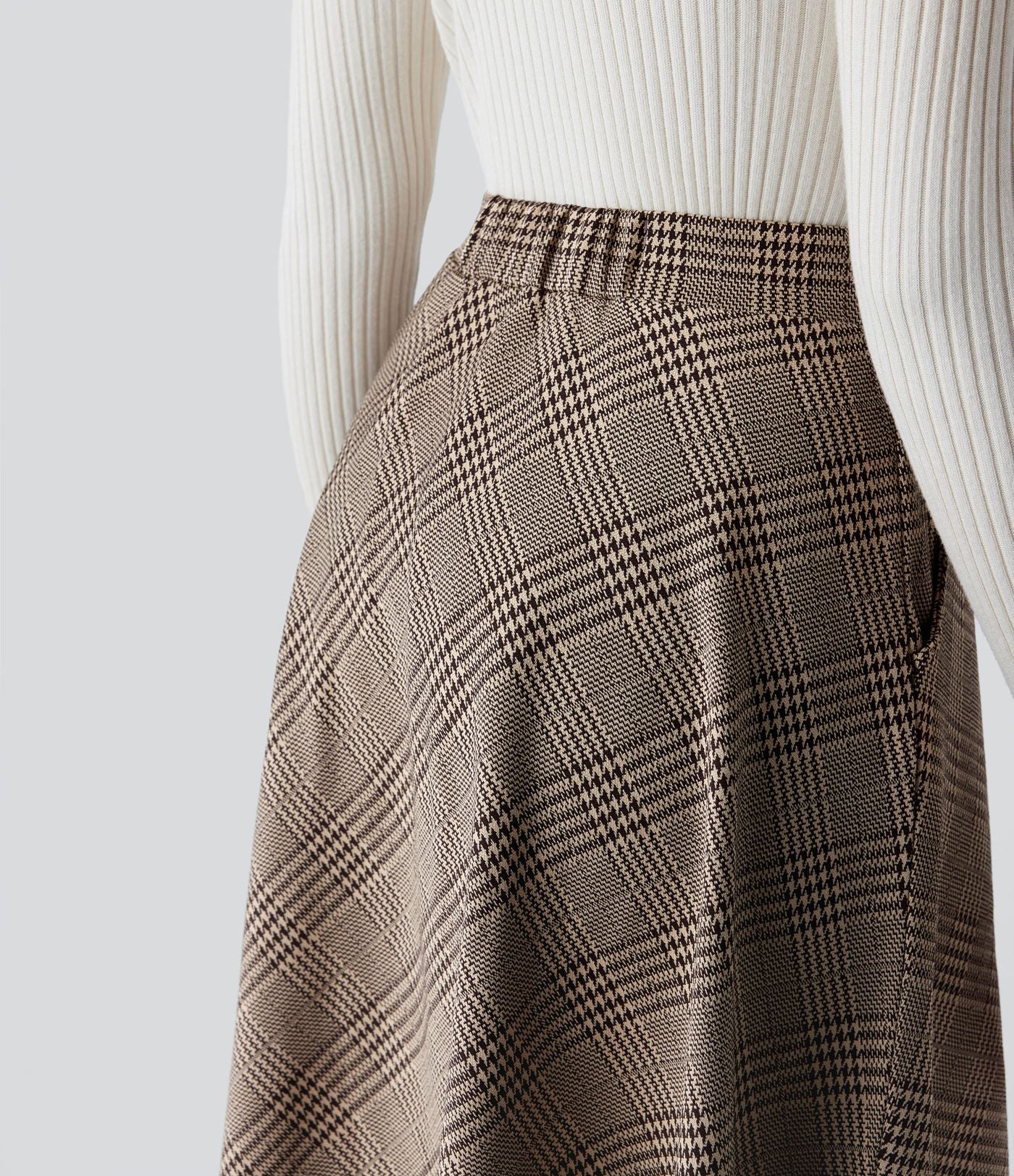 Jupe midi évasée à taille haute et poches latérales, motif pied-de-poule