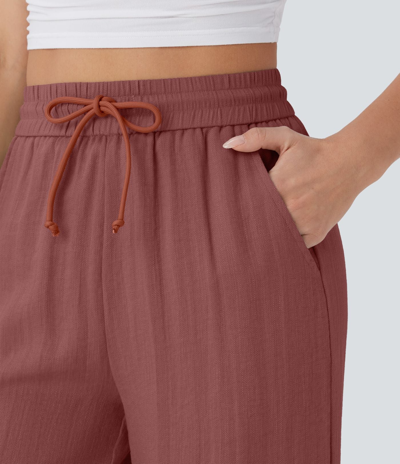 Pantalon large fluide taille haute avec cordon de serrage, poches latérales et aspect lin