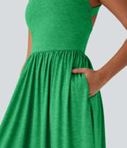 Robe longue fluide fendue avec poches latérales, dos nu et effet torsadé
