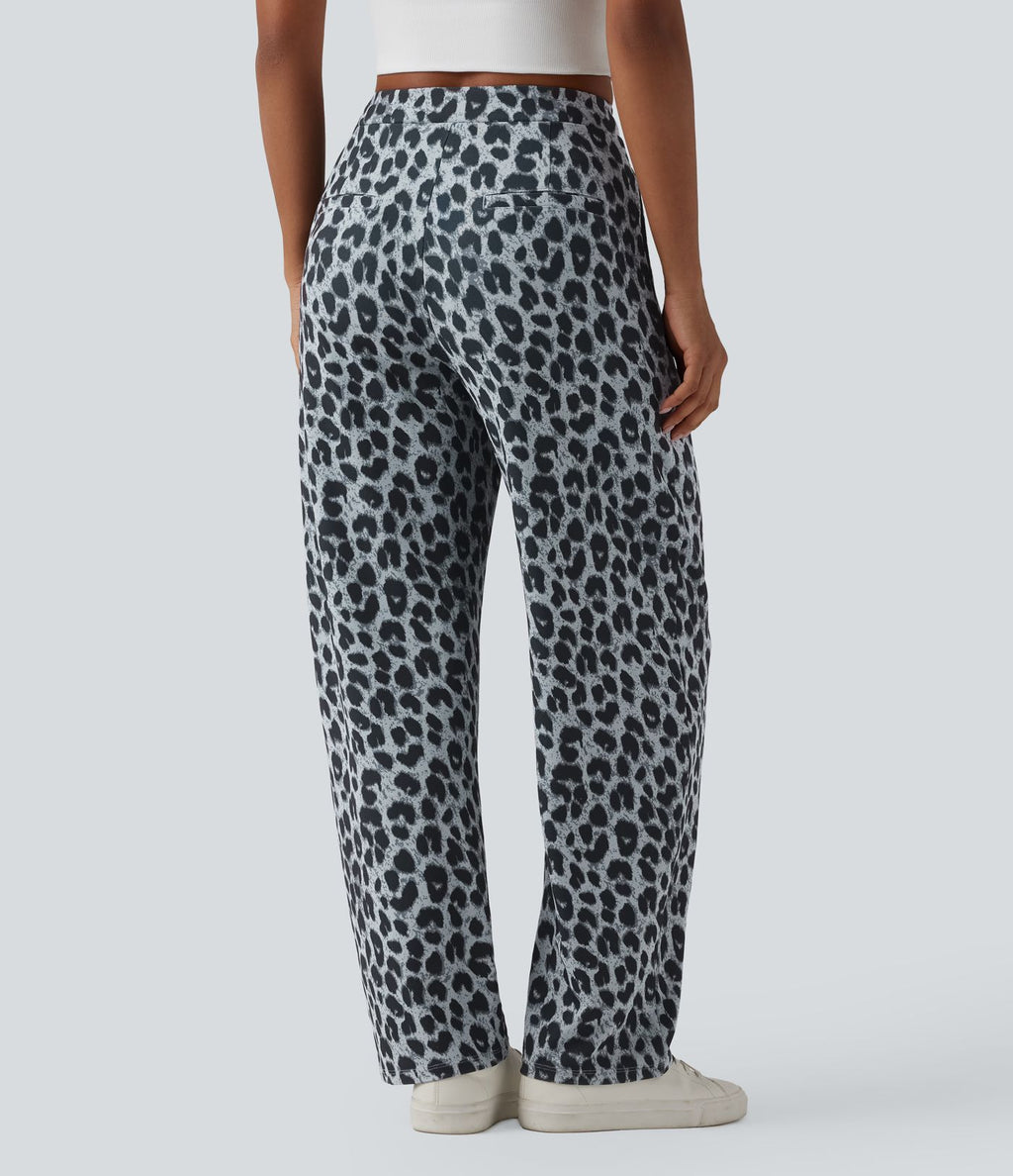 Pantalon tailleur fuselé asymétrique taille mi-haute gaufré imprimé léopard avec poches