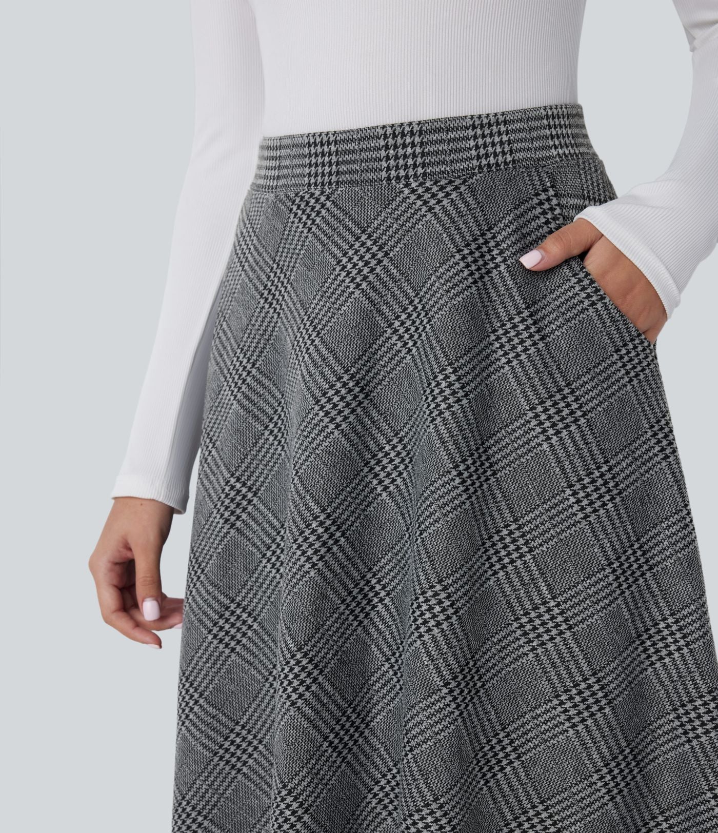 Jupe midi évasée à taille haute et poches latérales, motif pied-de-poule
