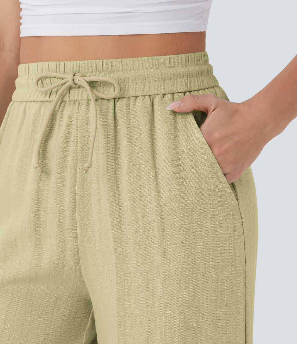 Pantalon large fluide taille haute avec cordon de serrage, poches latérales et aspect lin