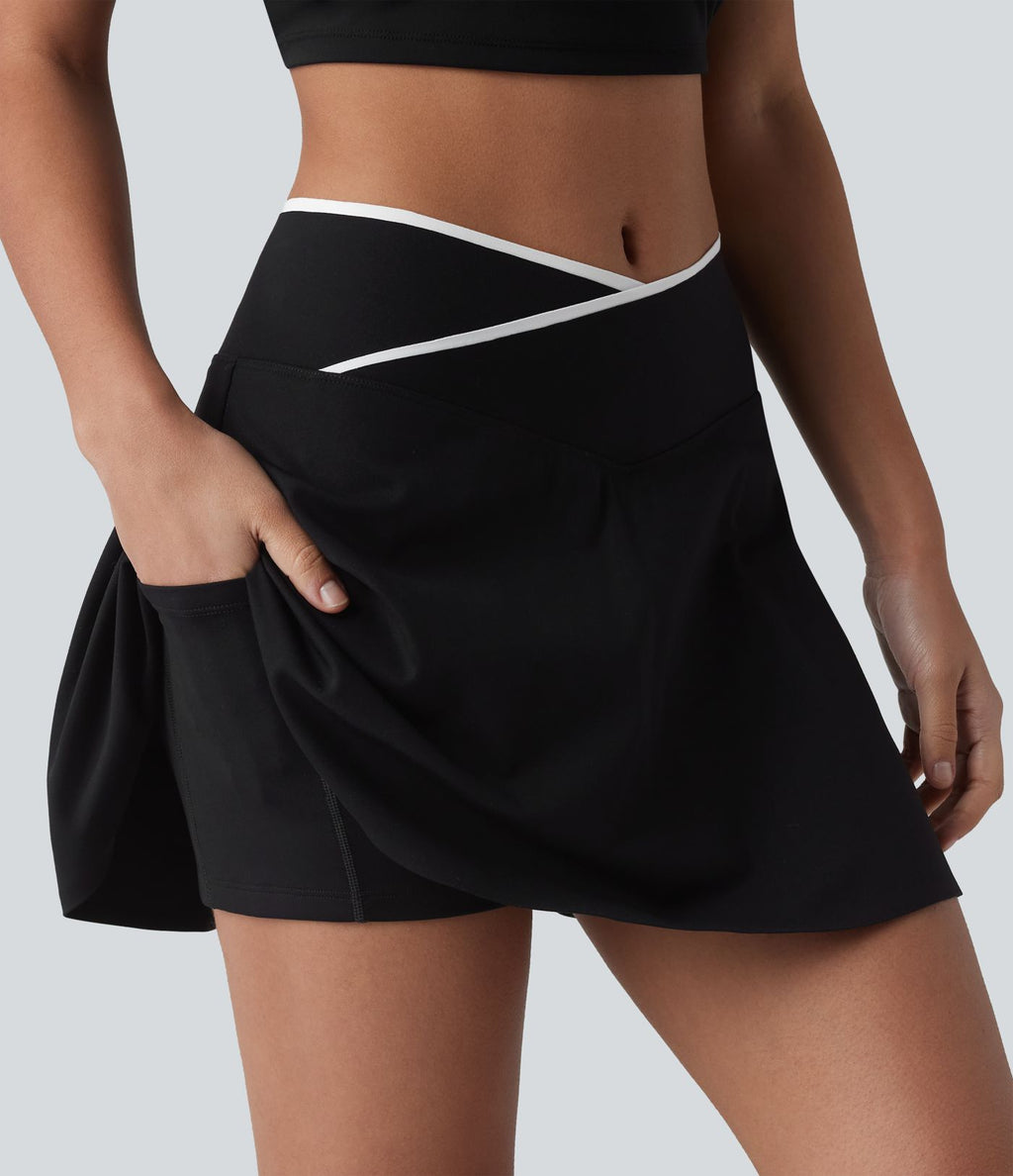 Jupe de tennis mini 2-en-1 color block croisée taille mi-haute avec poches