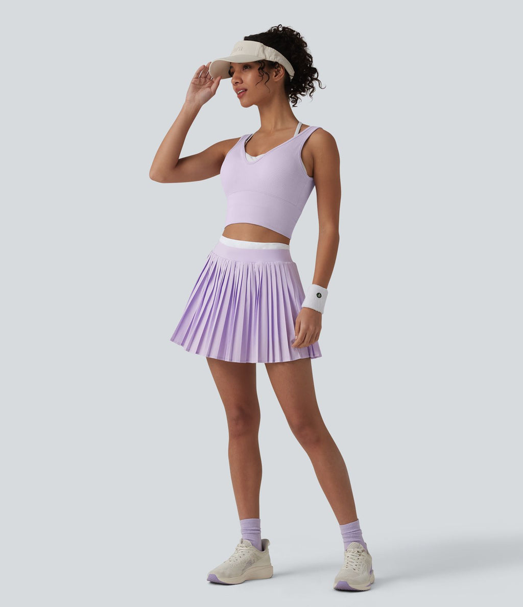 Jupe mini de tennis plissée 2-en-1 Breezeful™ color block taille haute à séchage rapide avec poches