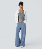Jean décontracté taille basse en maille gaufrée extensible, jambe large avec poches multiples et fermeture zippée