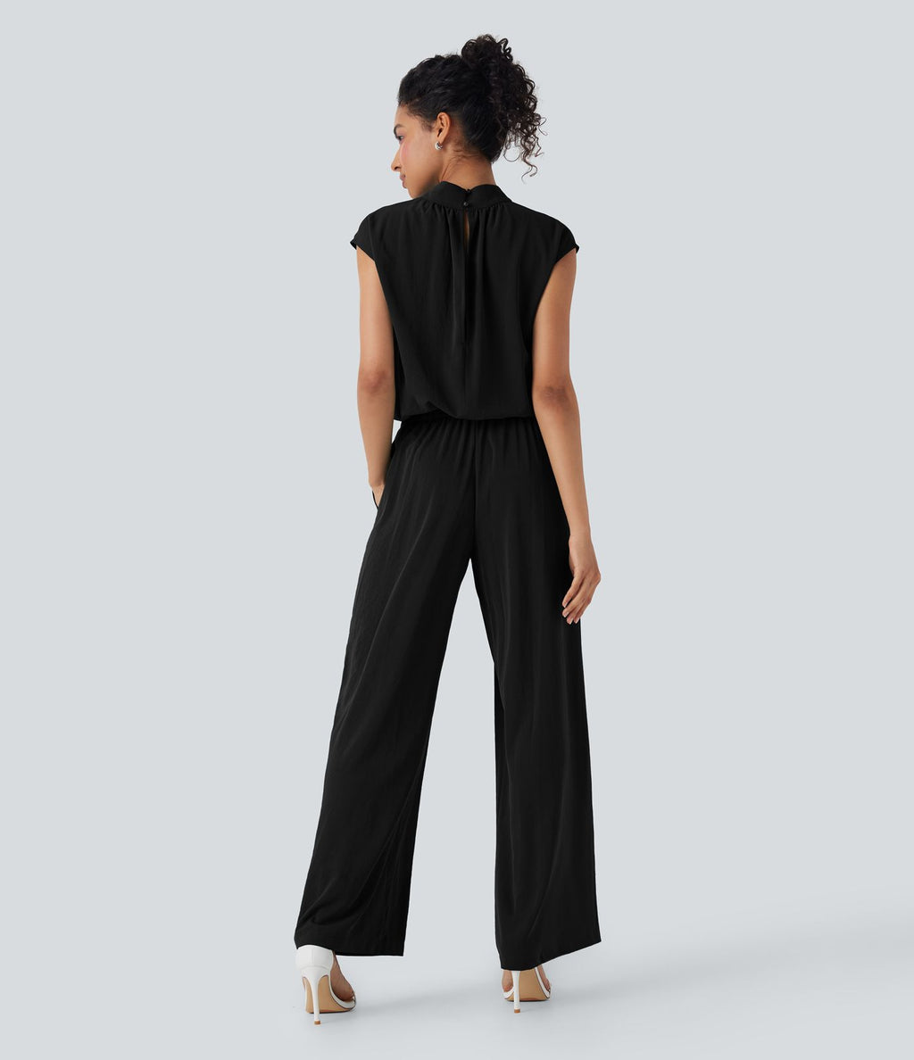 Combinaison pantalon tailleur jambes larges col montant dos goutte d'eau manches courtes avec poches latérales