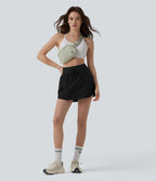Jupe de sport mini 2-en-1 taille haute coupe trapèze avec cordon de serrage et poches
