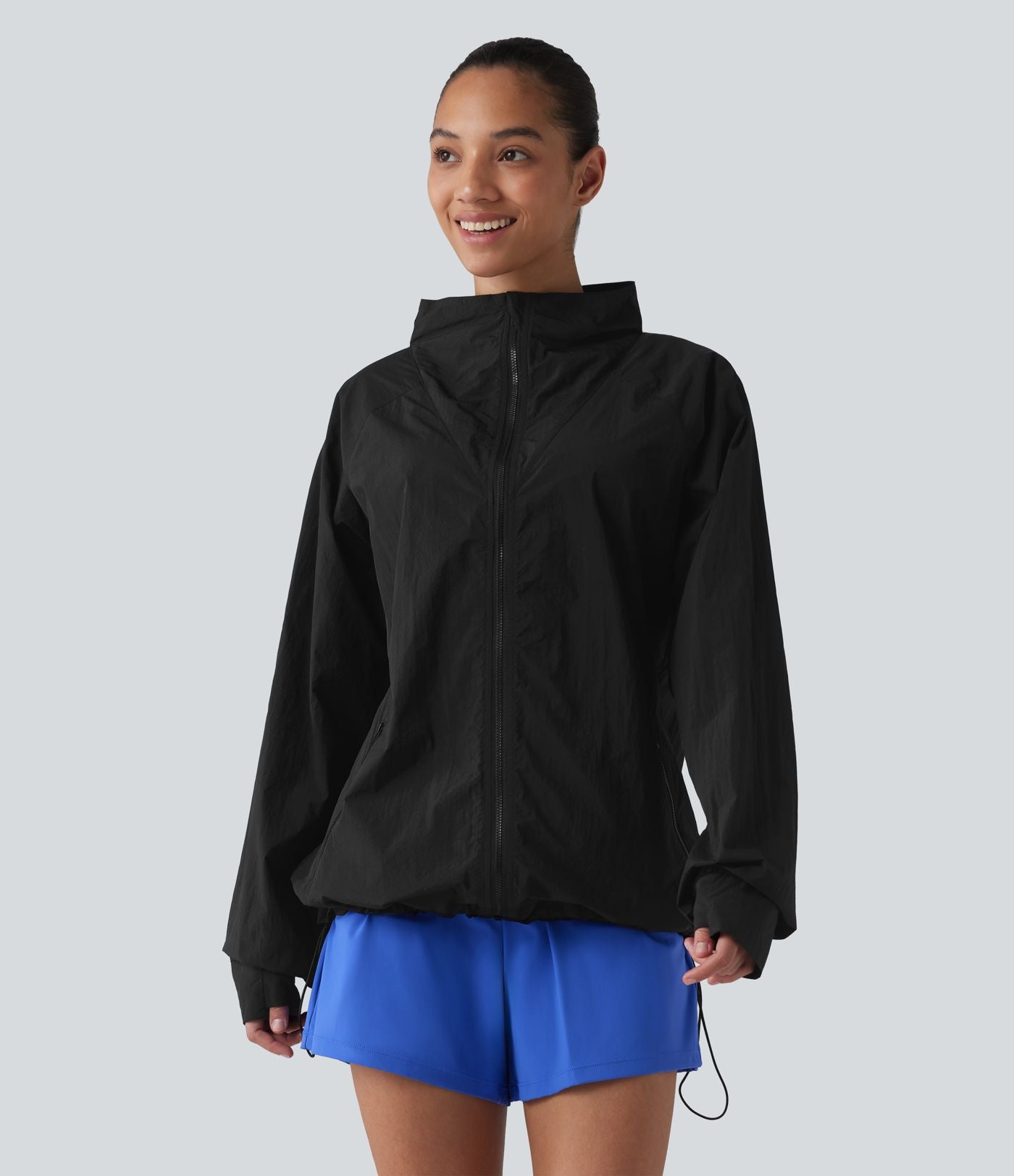 Coupe-vent casual à col droit avec trou pouces, cordon de serrage et poches