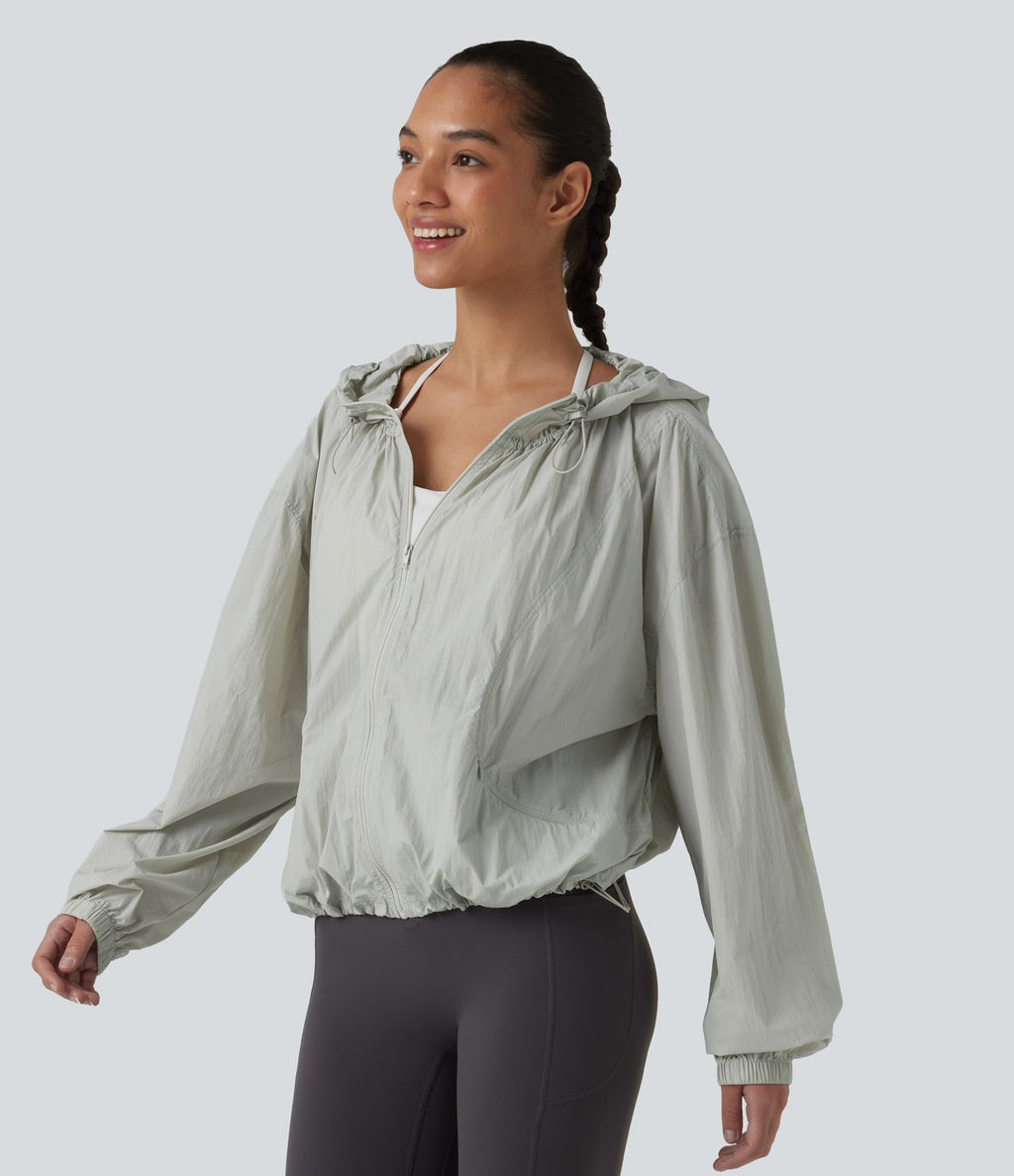 Veste de course légère à capuche manches longues avec poches, cordon de serrage et protection UPF 50+