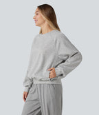 Sweat-shirt col rond manches longues à découpes avec poches