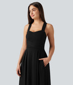 Robe longue fluide décontractée sans manches décolleté en cœur bretelles croisées avec lien dans le dos et poches