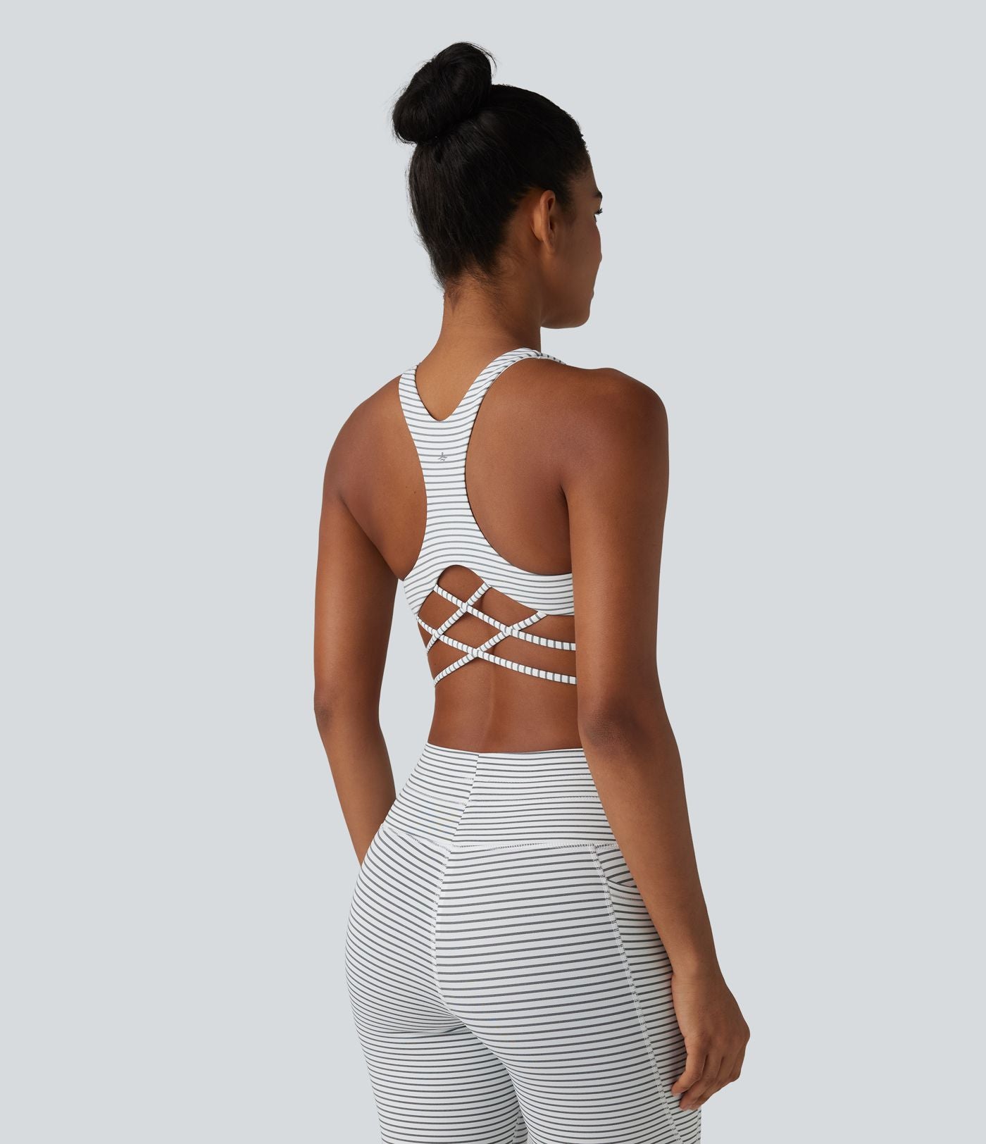 Brassière de sport yoga à rayures dos nageur croisé maintien léger avec soutien-gorge intégré