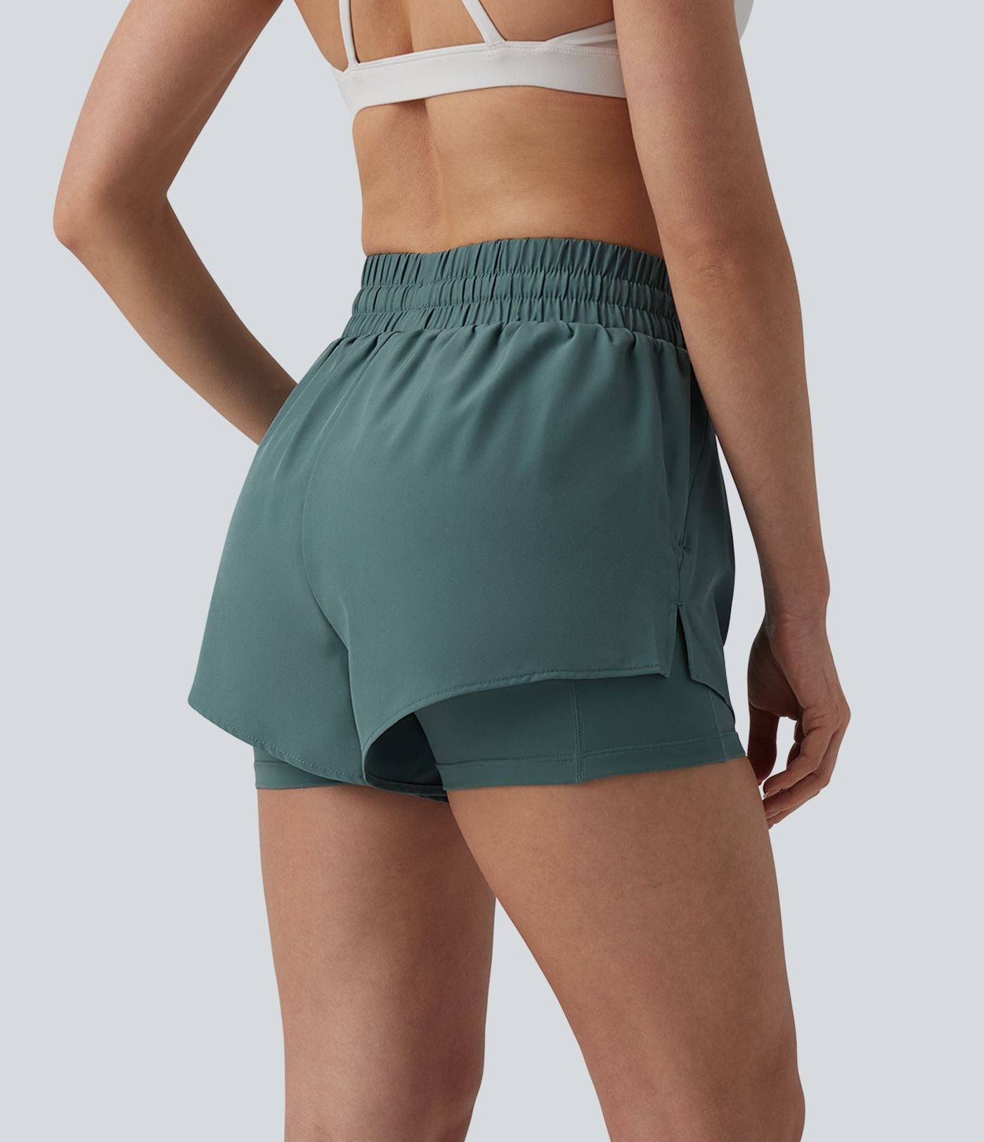 Short running 2-en-1 taille haute avec cordon de serrage et poches