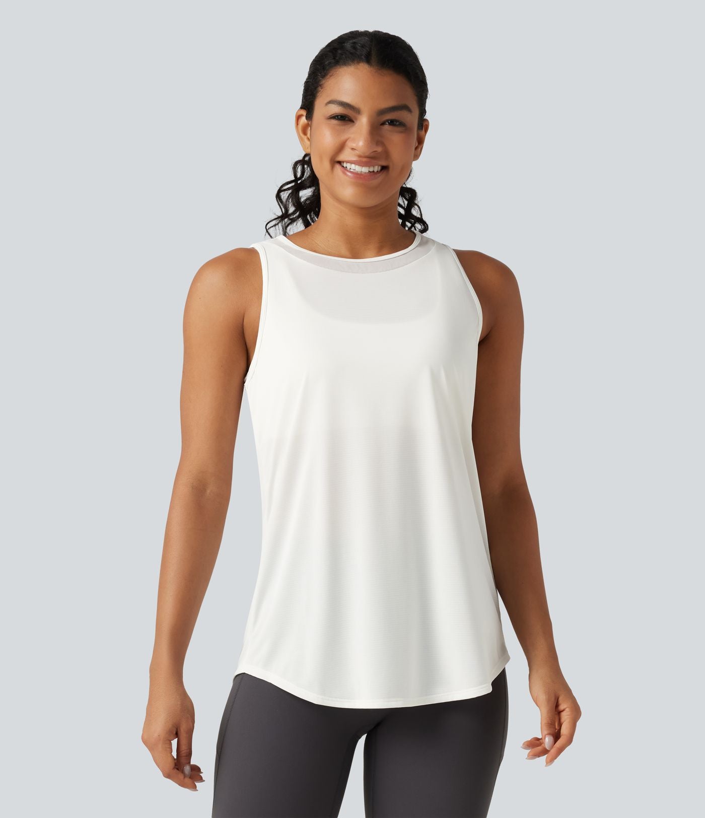 Débardeur de running longueur allongée en mesh contrasté avec ourlet arrondi
