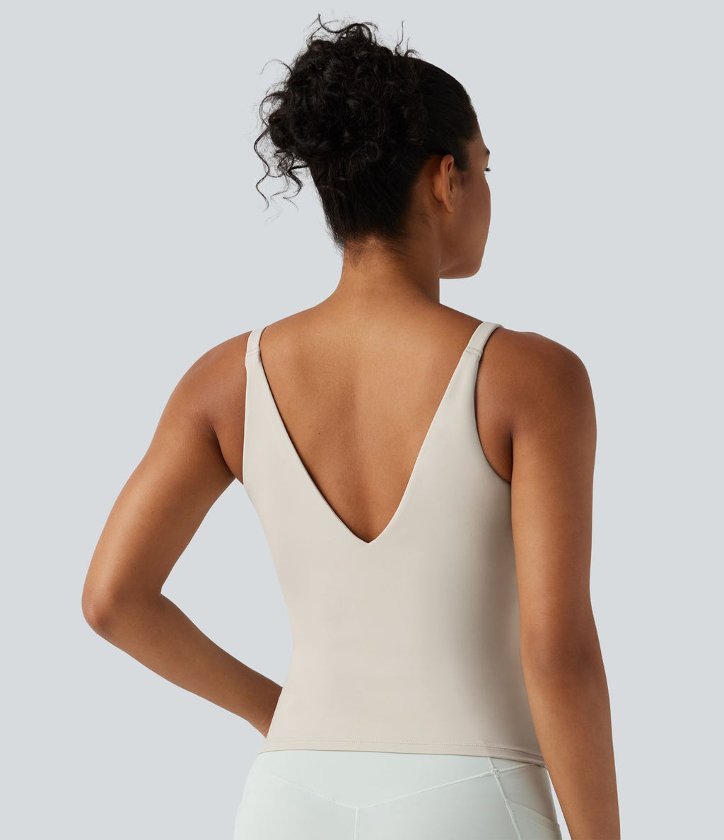 Débardeur de sport effet lissant sous les bras avec dos en V et brassière intégrée