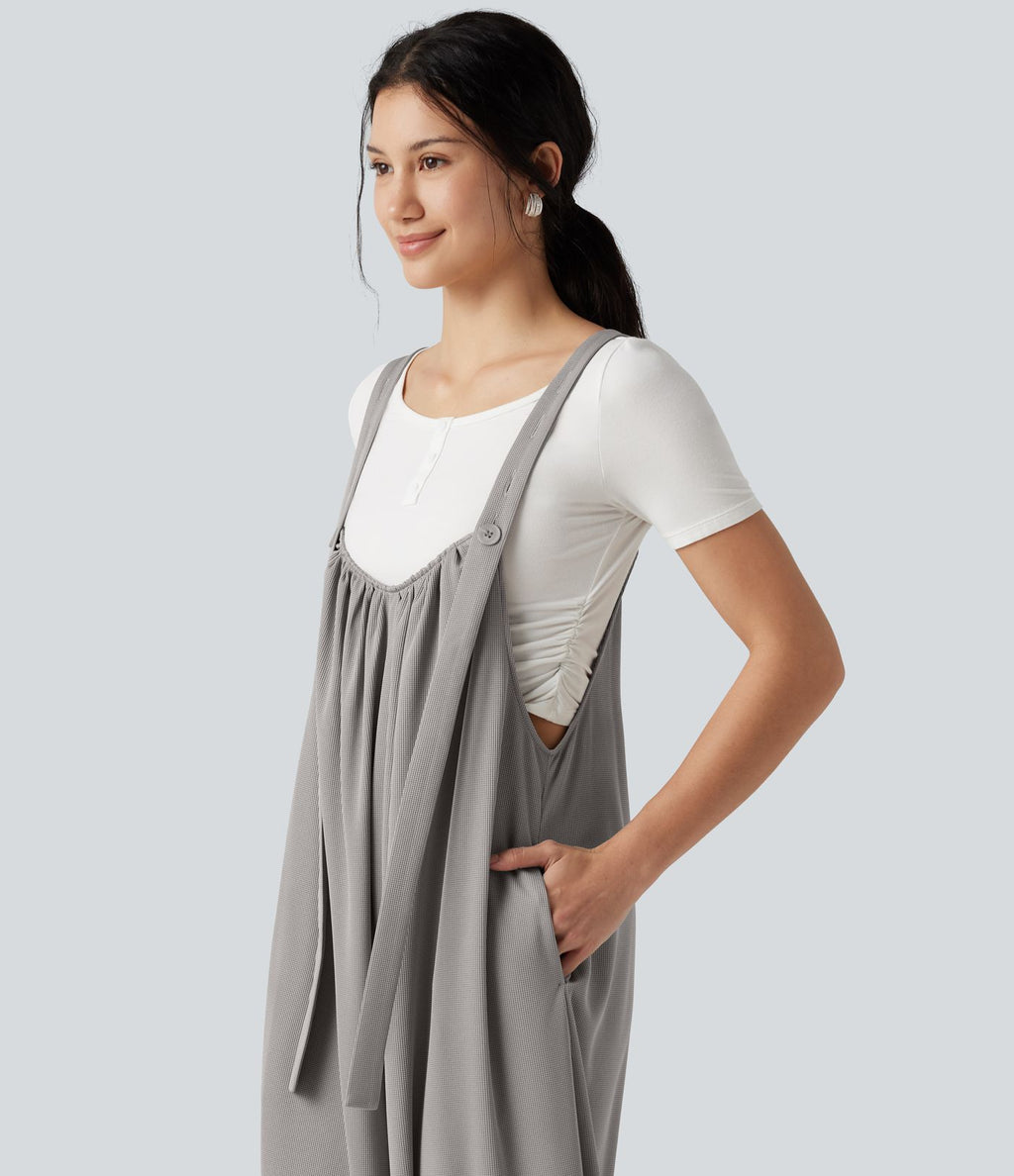 Combinaison fluide coupe baggy en tissu gaufré avec bretelles ajustables et poches