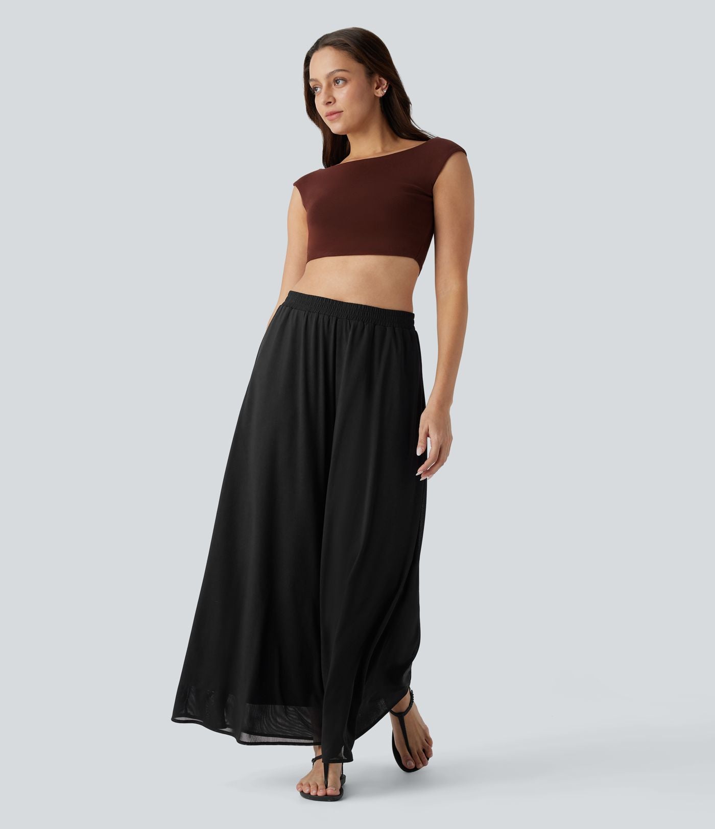 Pantalon fluide et ample avec superposition en mesh, poches latérales et taille haute