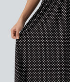 Robe fluide décontractée midi sans manches dos nu croisée à pois avec poches