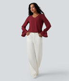 Blouse col V à volants manches longues