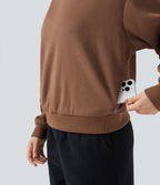 Sweat en coton molleton col rond manches longues avec poches
