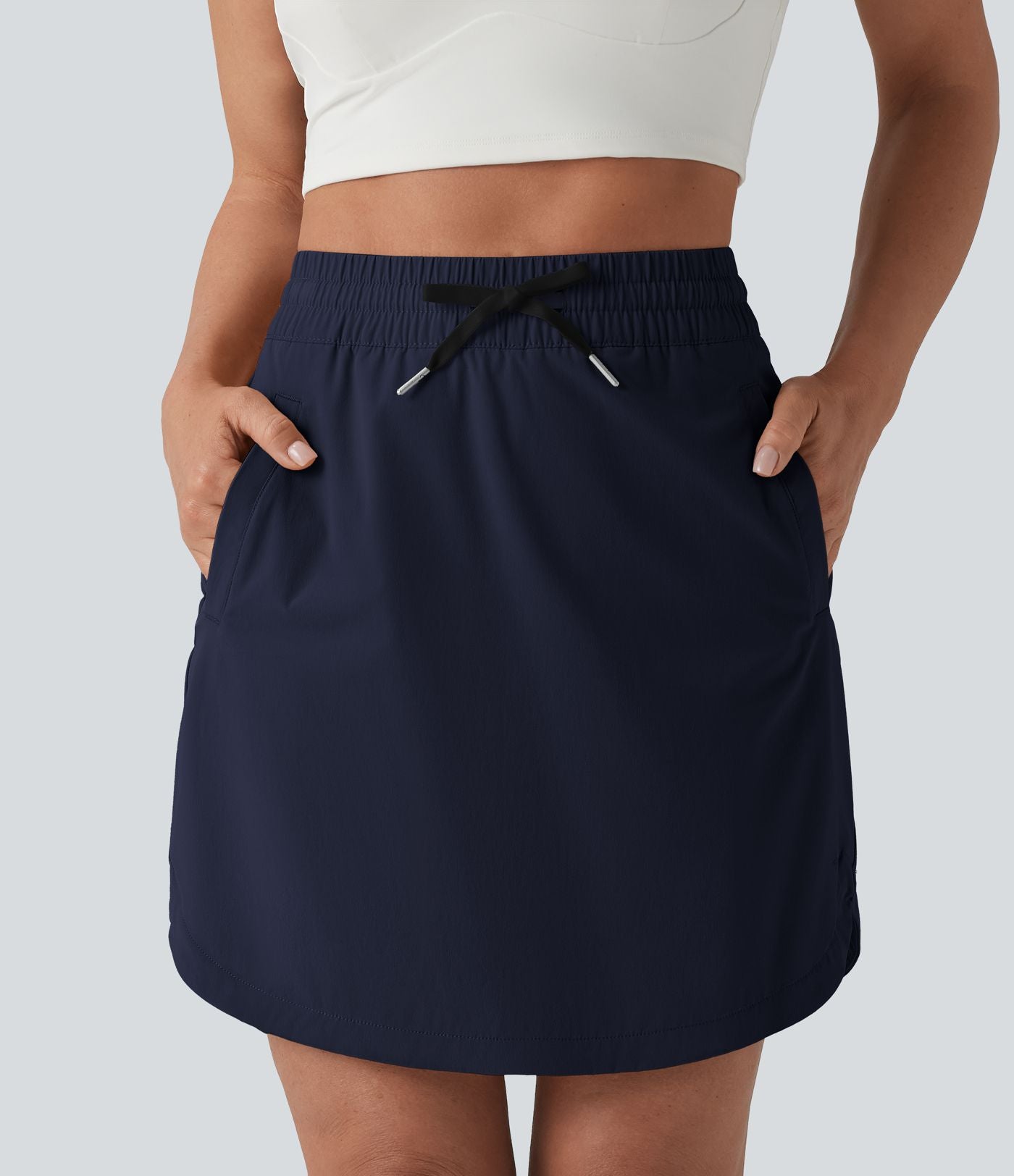 Jupe-short golf mini 2-en-1 taille haute à cordon de serrage et ourlet arrondi avec poches - Longueur plus longue
