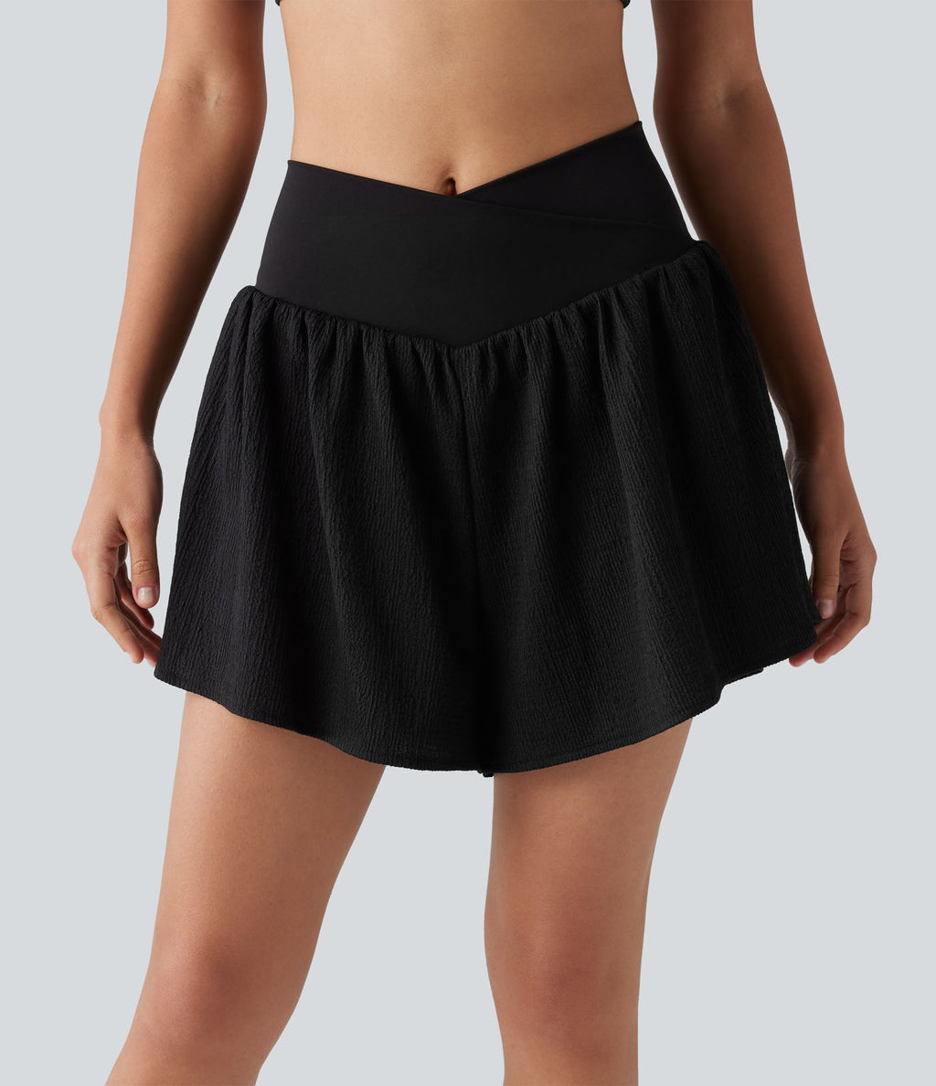 Short de running 2-en-1 taille haute croisée en tissu froissé avec ourlet fendu et poches