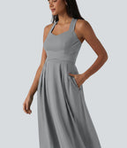 Robe midi fluide sans manches décolleté cœur avec bretelles croisées, nœud dans le dos et poches