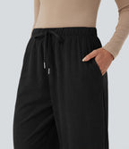 Pantalon taille mi-haute à cordon, jambe tombante en velours côtelé avec poches