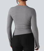 Top de sport yoga col rond ourlet asymétrique fendu manches longues avec trous pouces