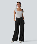 Pantalon tailleur évasé asymétrique taille mi-haute avec poches