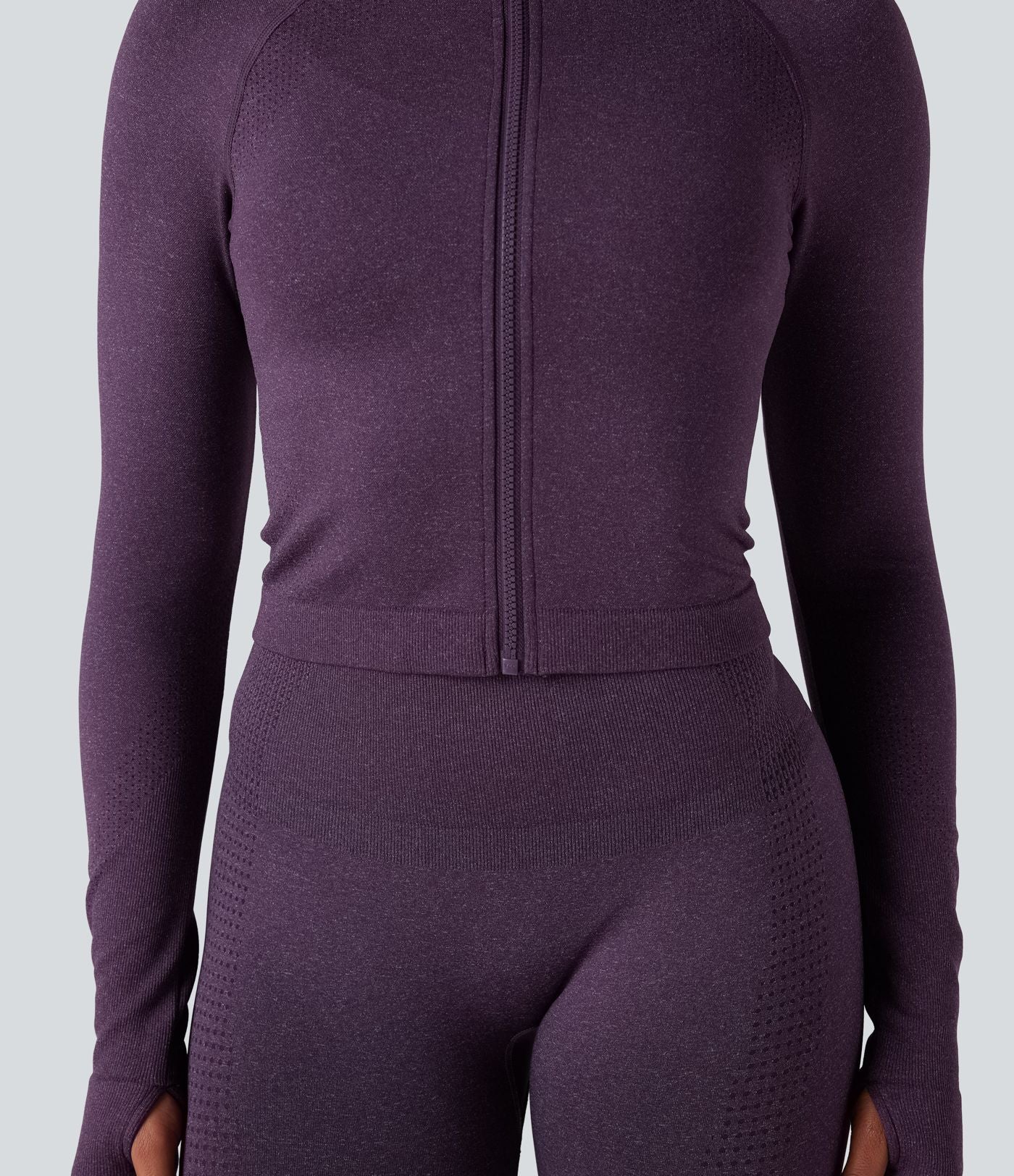 Veste de yoga courte ajustée Seamless Flow à col montant, manches longues et trous pour les pouces
