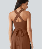 Robe midi fluide sans manches décolleté cœur avec bretelles croisées, nœud dans le dos et poches