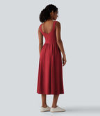 Robe midi fluide sans manches dos croisé ouvert avec poches