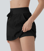 Jupe de sport mini 2-en-1 taille haute coupe trapèze avec cordon de serrage et poches
